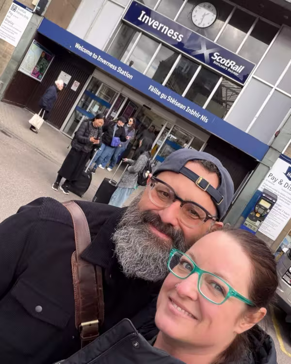 Erik Wolf and his fiancé outside Inverness Station in Scotland.
